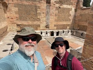Professor and student at ancient ruins